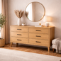 Wooden dresser with decorative items in a bedroom setting