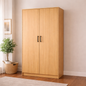 Wooden wardrobe with two doors in a room with a plant and basket.