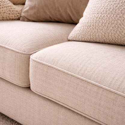 Close-up of a beige sofa with cushions